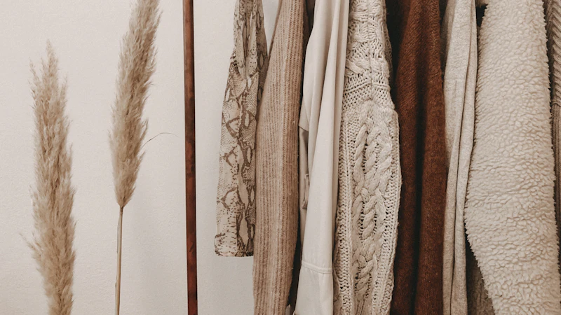 hanged top on brown and white clothes horse