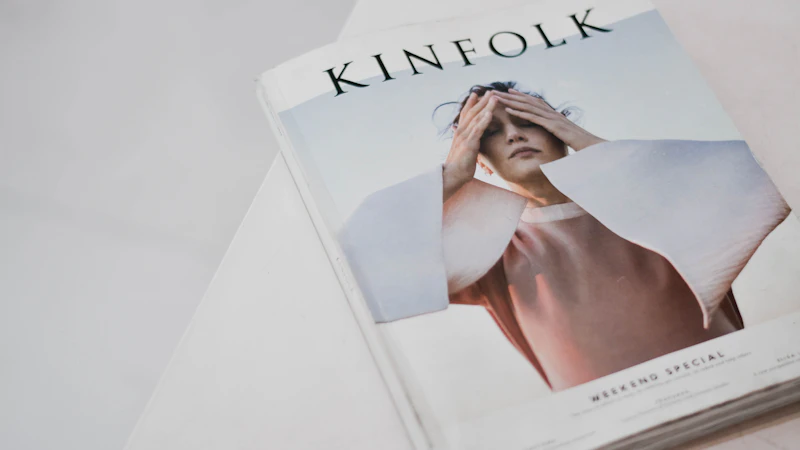 a magazine with a picture of a woman covering her eyes