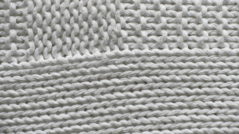 white knit textile on white surface