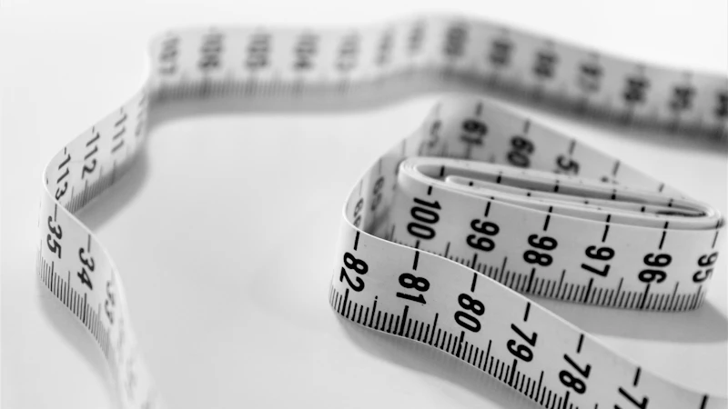 selective focus photography of tape measure