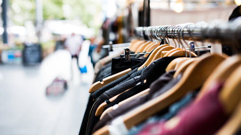 selective focus photography of hanged clothes