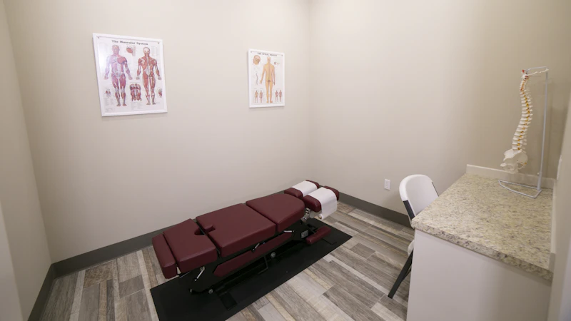red leather padded massage bed inside building