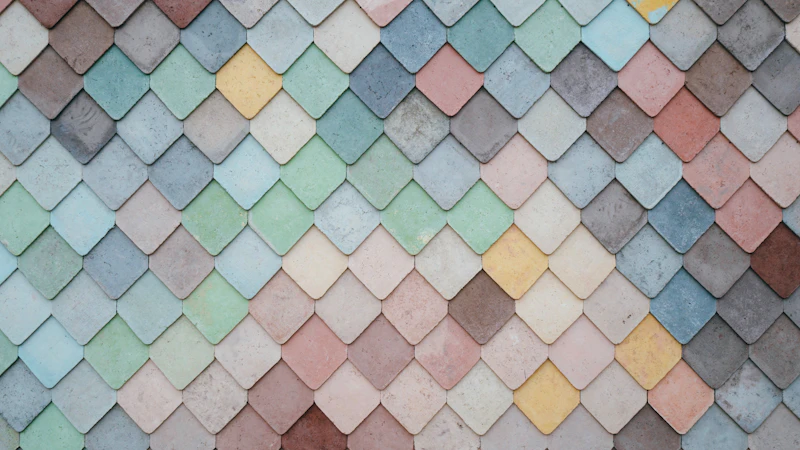 a multicolored tile wall with a pattern of small squares
