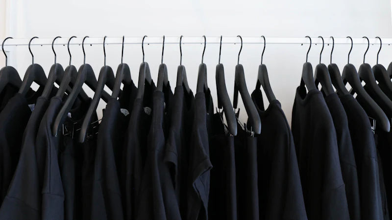 black clothes hanged in rack