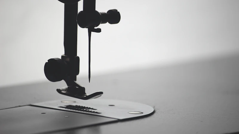 macro photography of sewing needle