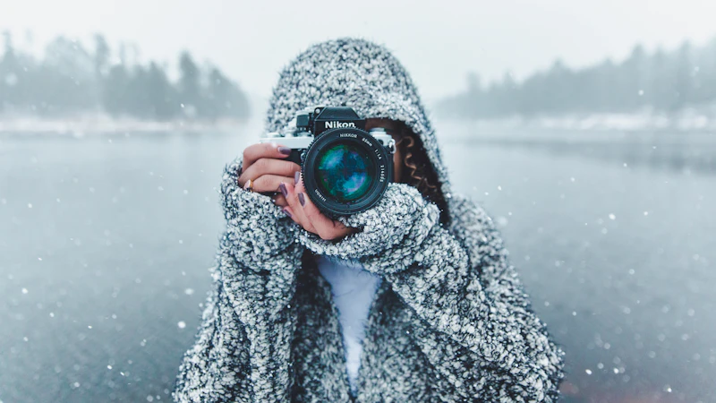 woman using Nikon DSLR camera