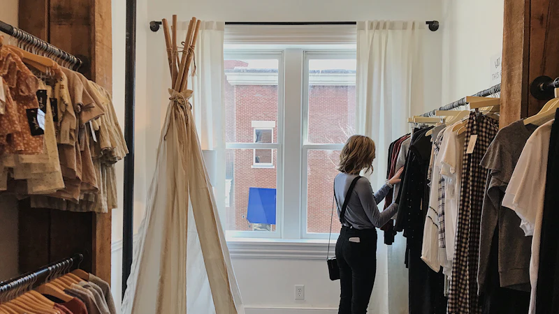 woman standing selecting clothes