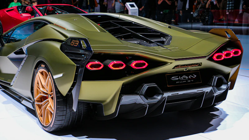 green Lamborghini sports car with taillights turned on