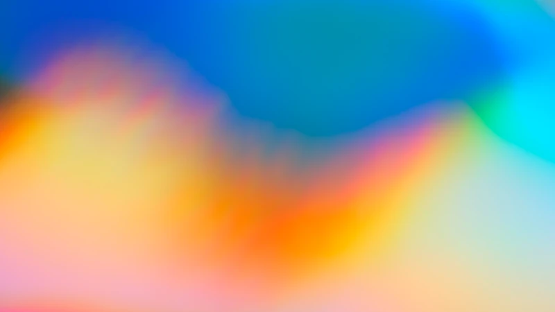 a blurry image of a rainbow colored background