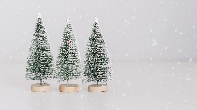 several miniature green-and-white pine tree table decors