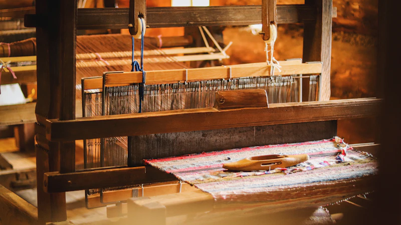 a weaving machine with a piece of cloth on it
