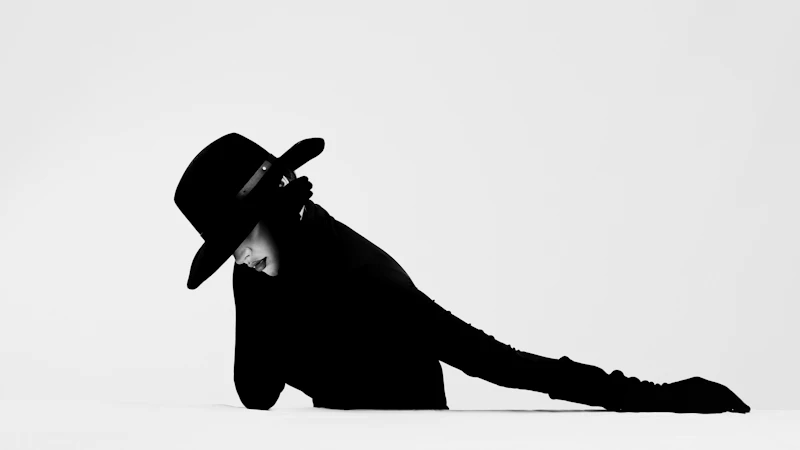 silhouette of a person wearing cowboy hat