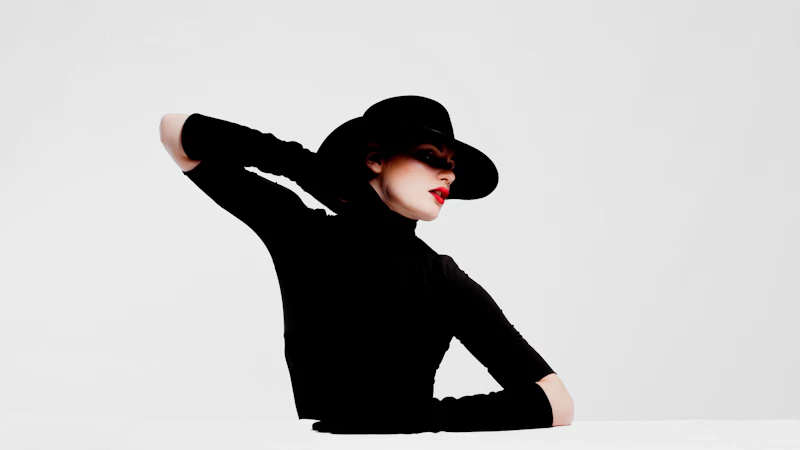 woman in black long sleeve shirt and black hat