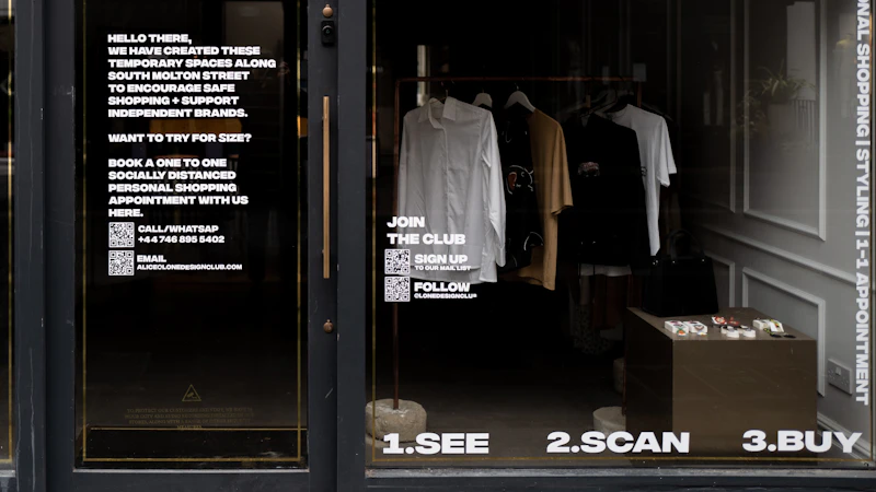 white dress shirt hanging on brown wooden cabinet