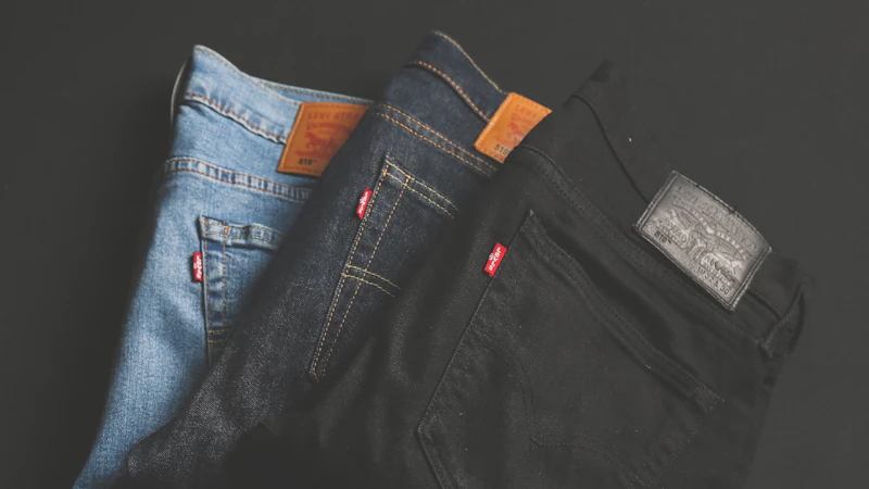 three assorted-color denim bottoms