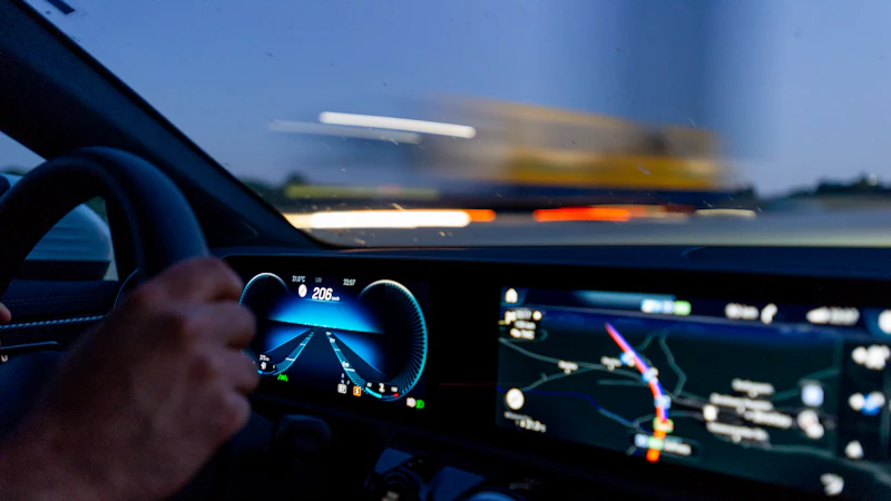 person's hand on steering wheel