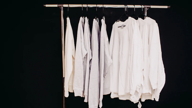 white dress shirt hanging on clothes hanger
