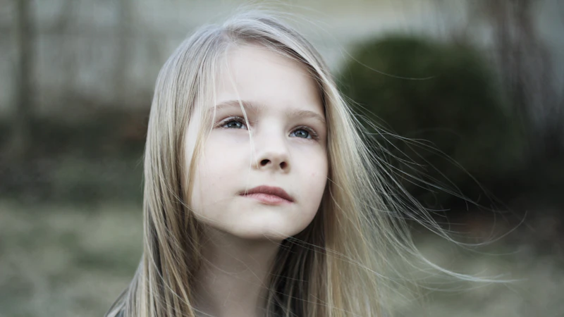 close-up photography of girl in black top during daytime