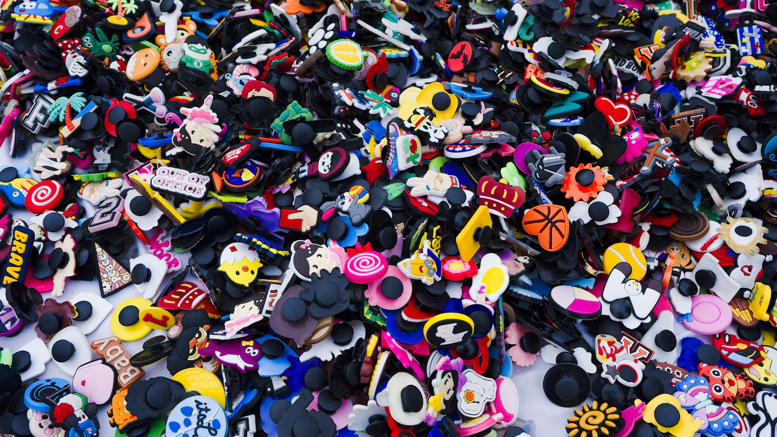a pile of different colored and shaped buttons