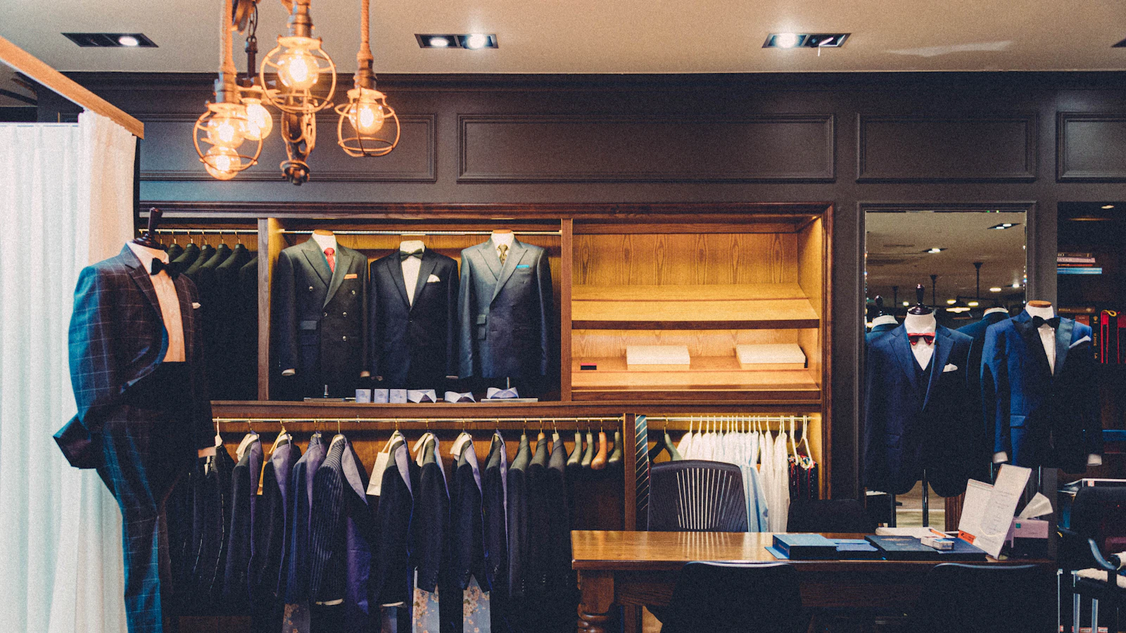 black suit jacket on brown wooden chair