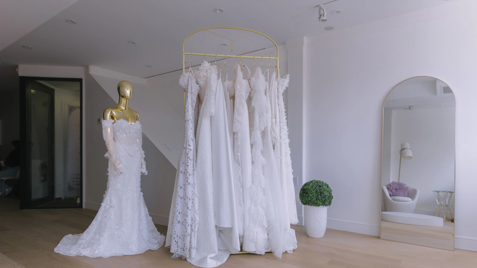 Elegant wedding dresses displayed in a modern bridal boutique