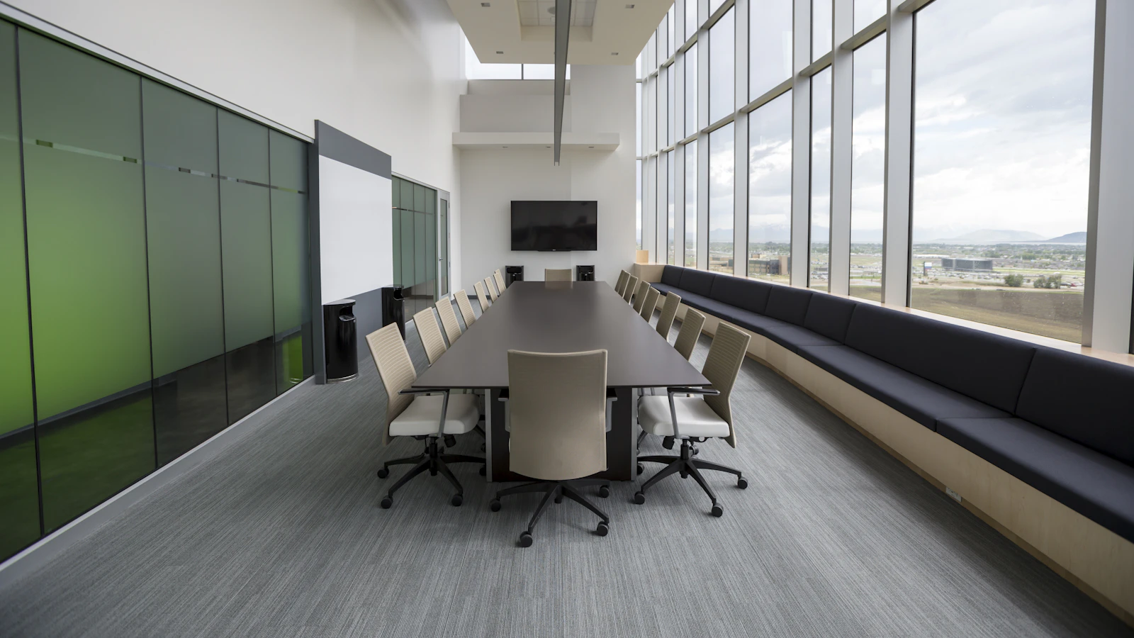 rectangular brown wooden table with chair lot inside building