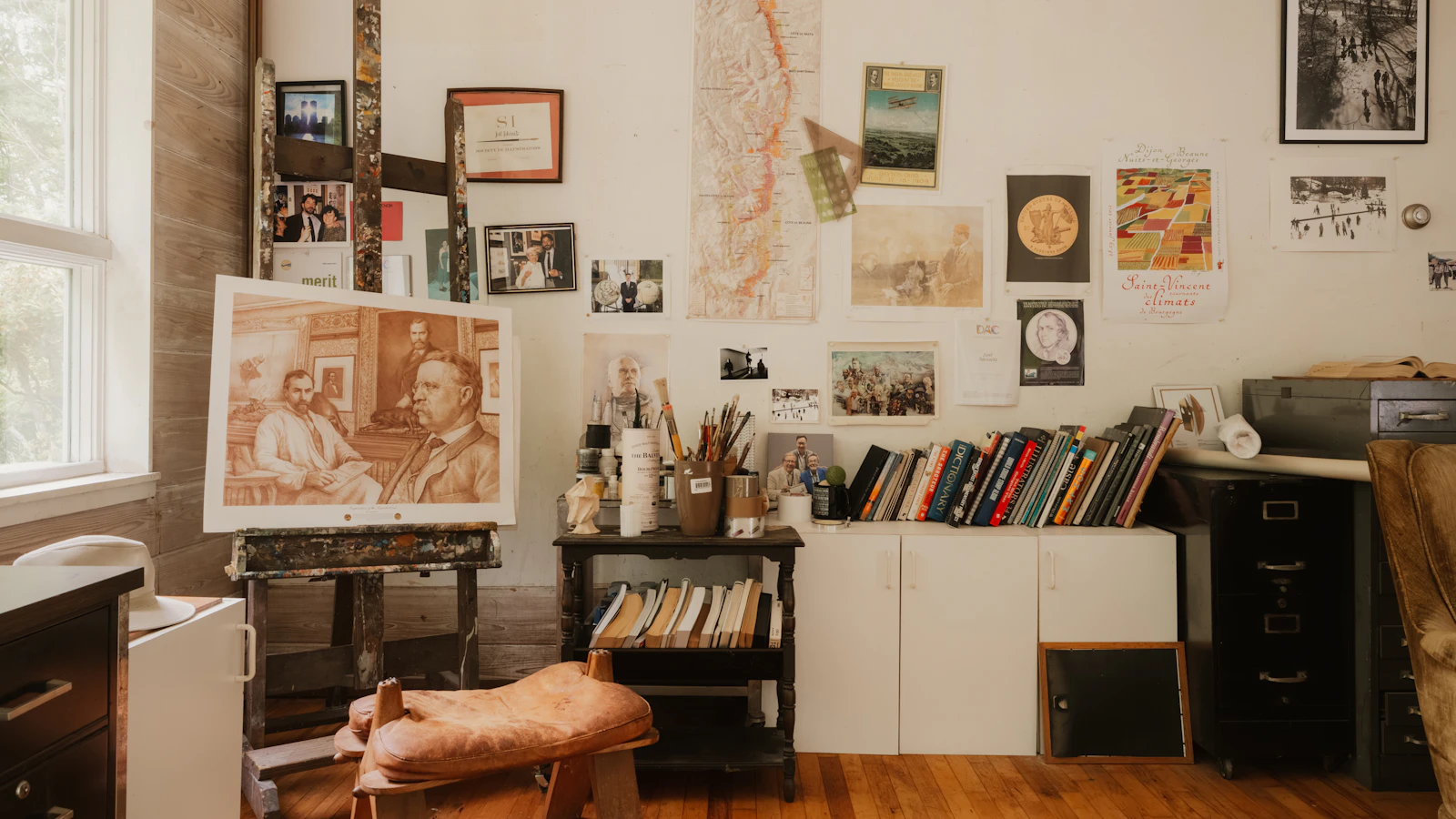 Creative artist's studio with easel, painting, and art supplies