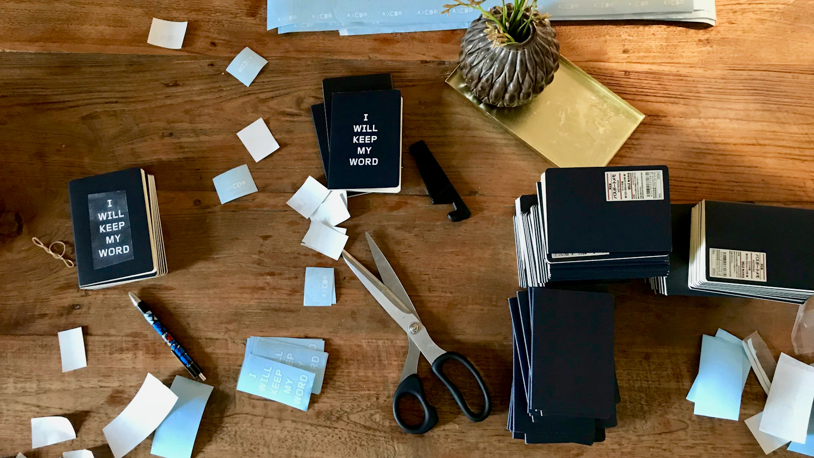 books, papers, and items on brown surface