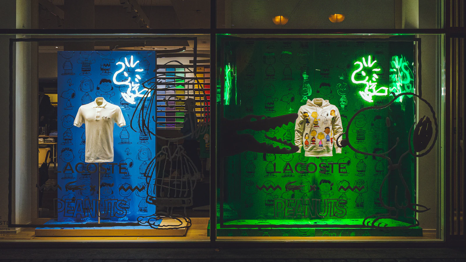 a display case with a t - shirt and other items in it