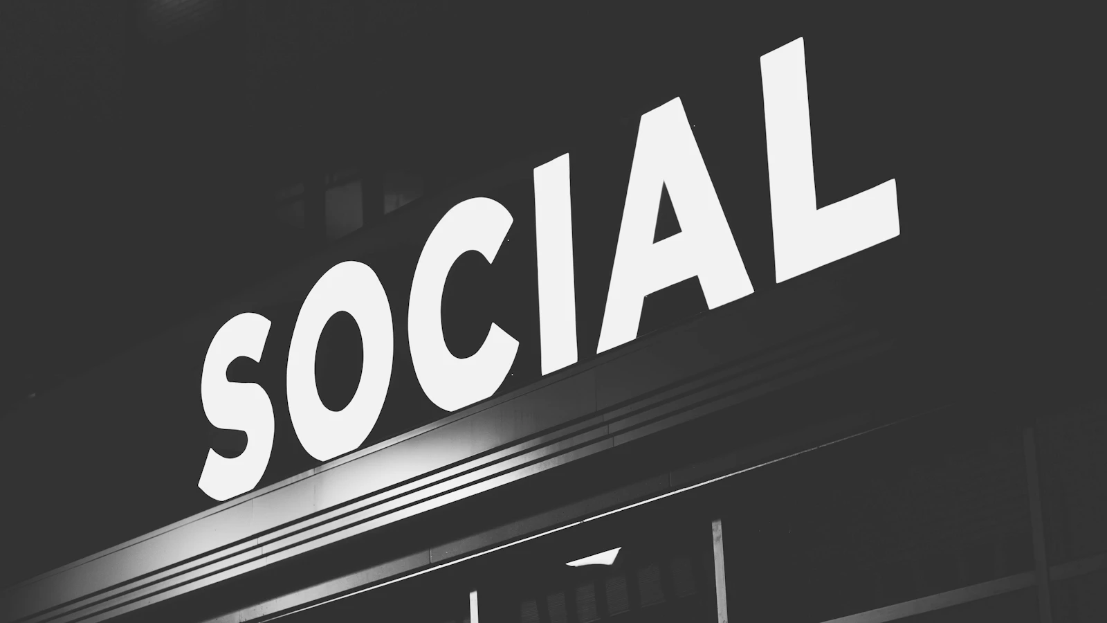 white Social signage at nighttime