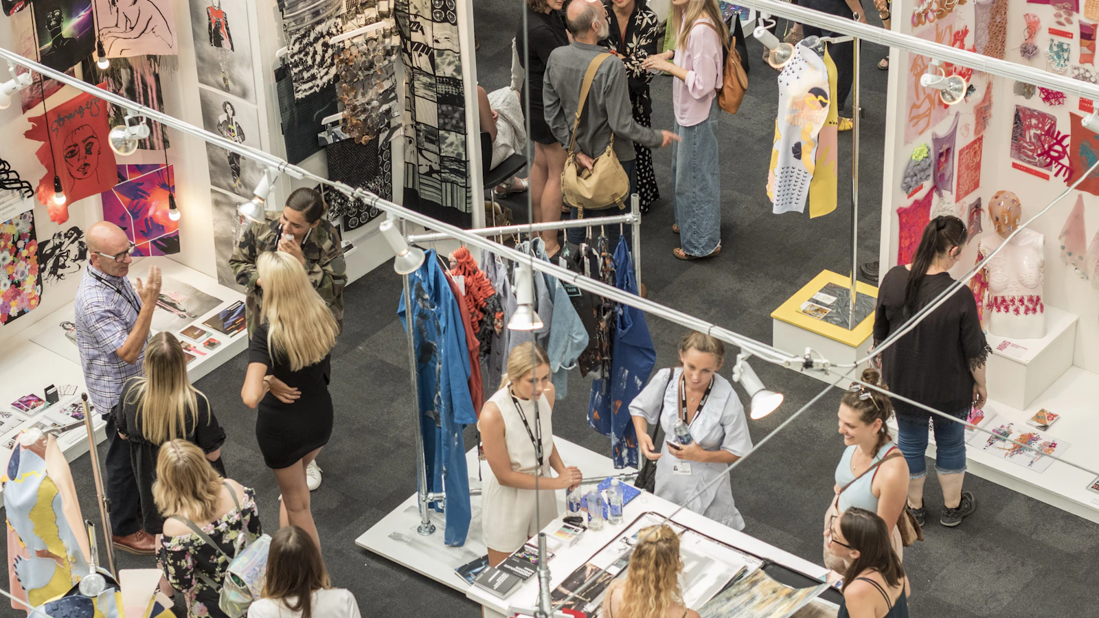 group of people gather in clothes stores