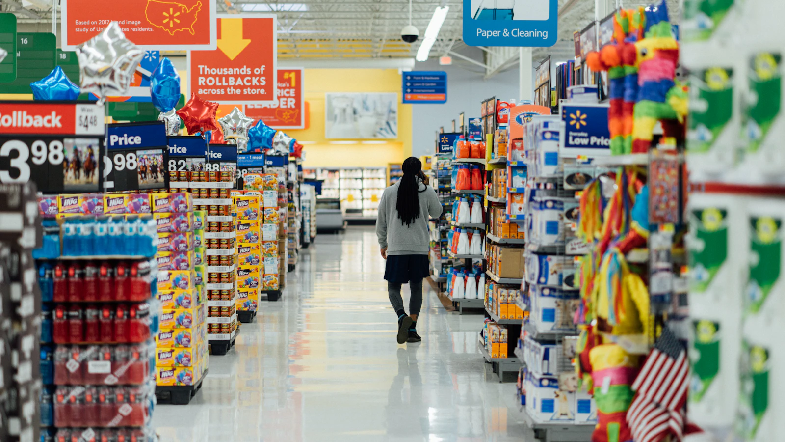 person standing between shelvings