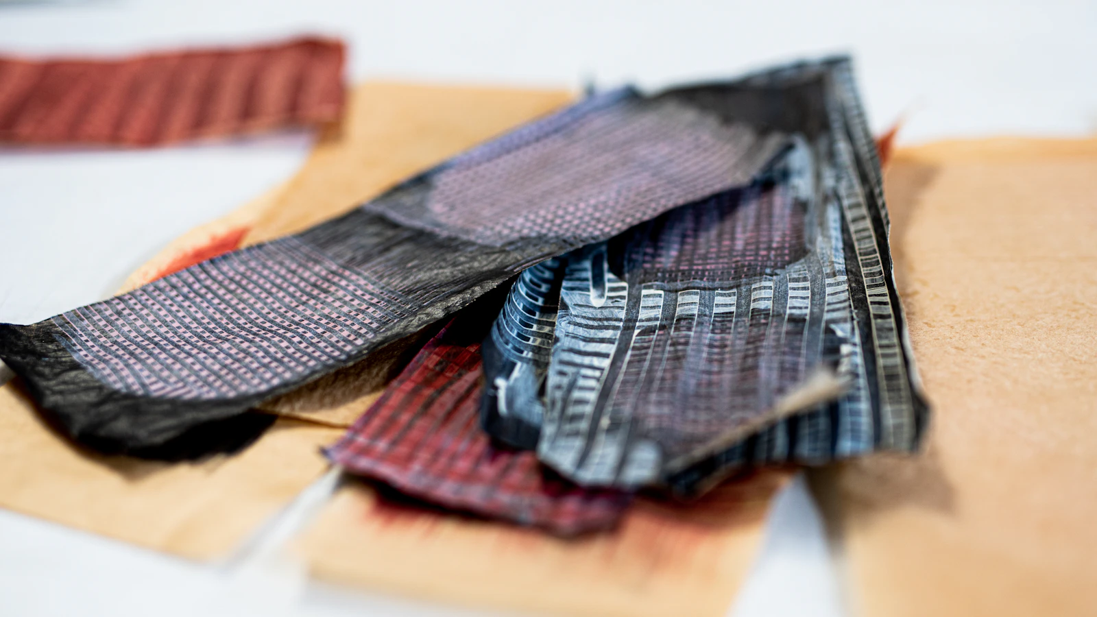 brown and black textile on brown wooden table