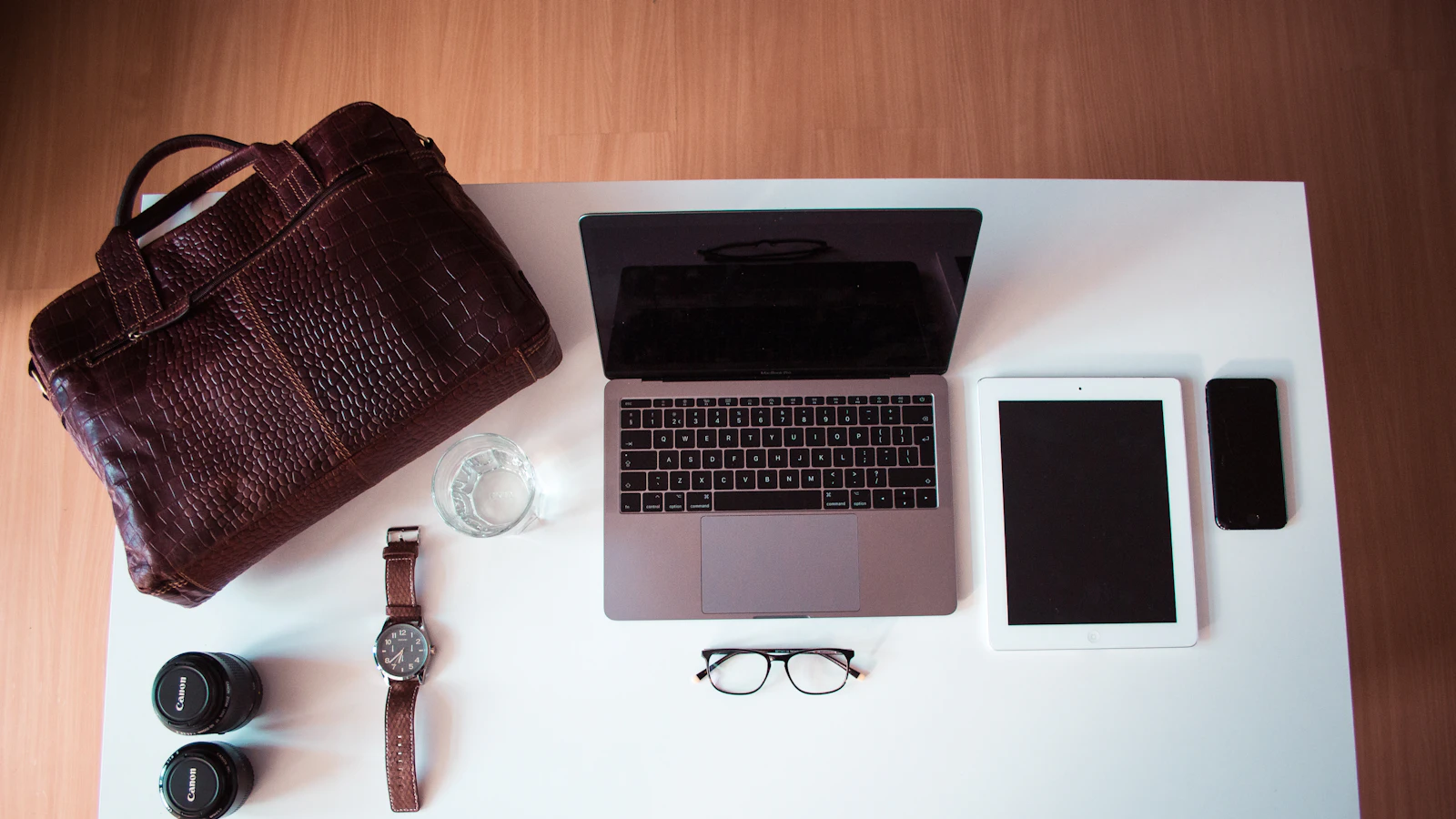 Apple Macbook Pro, iPad and iPhone on table