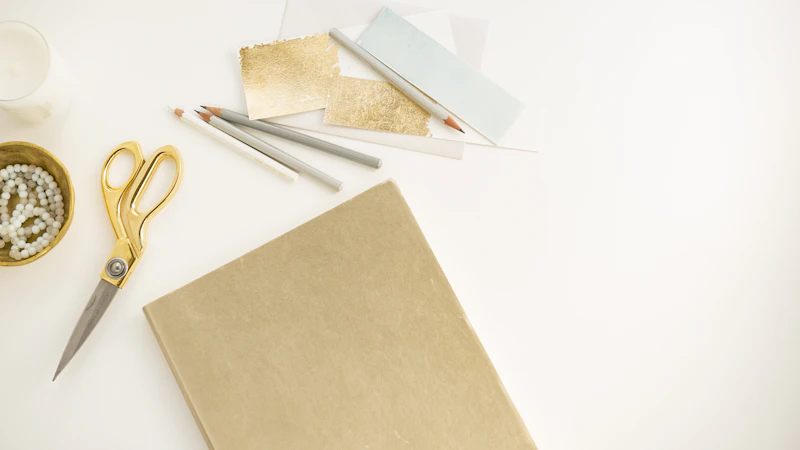 yellow handled scissors beside brown paper