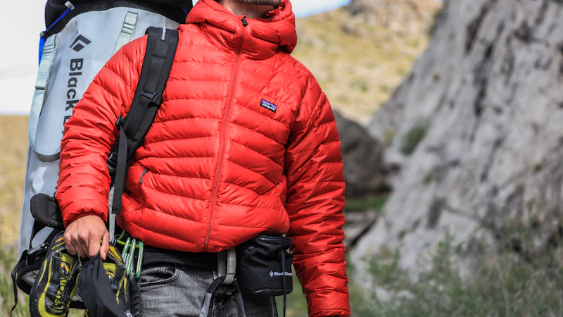 man looking above carrying gray camping backpack