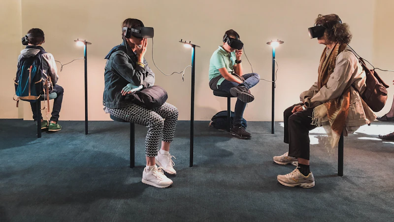 four person playing virtual reality goggles