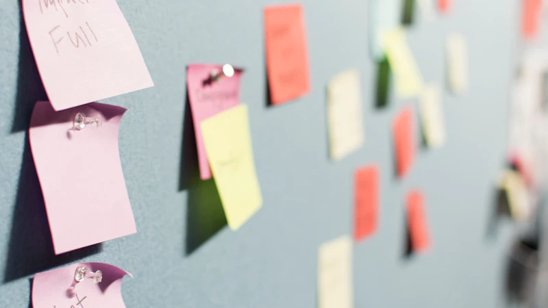 colorful sticky notes pinned to board