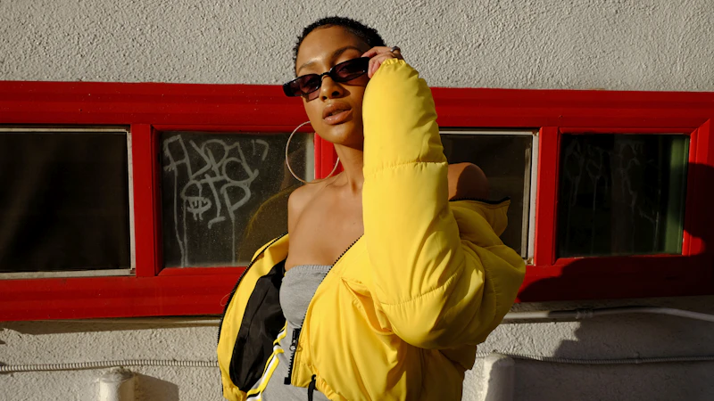 woman holding her sunglasses